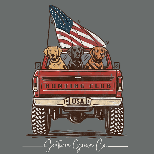 Kids Hunting Club Tee full back graphic featuring Labrador retrievers in a pickup truck bed with the American flag waving